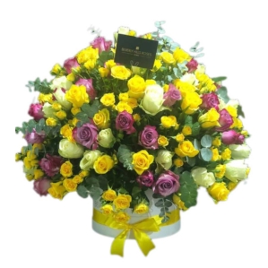 Yellow, White & Purple roses in Round Box