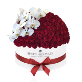 Red roses with white orchids in 'Hollywood Royal Globe'