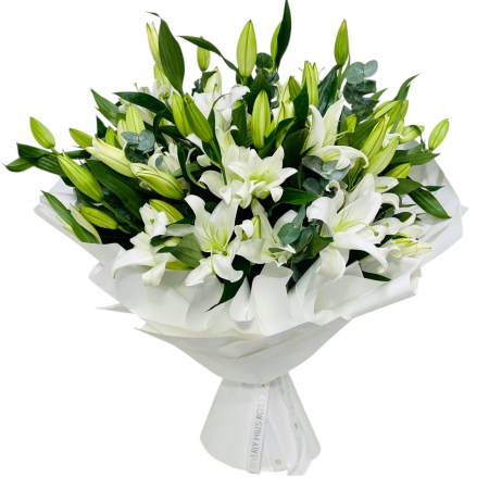 Elegant Serene White Lily Hand Bouquet from Beverly Hills Roses, perfect for UAE delivery, expressing purity and sympathy