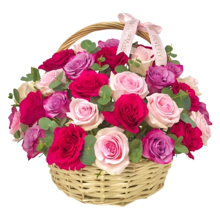 Mixed pink and purple roses basket arrangement