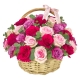 Mixed pink and purple roses basket arrangement